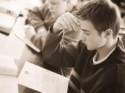 A thoughtful student. What is he thinking about?