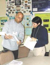 Biocomplexity workshop participants share insights during the poster session