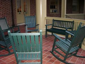 Empty chairs on a portico