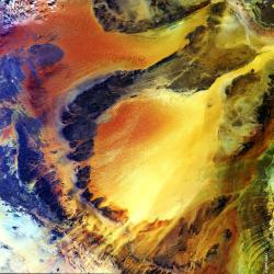 Envisat image shows Ubari and Murzuq sand dune seas in the Fezzan region of southwestern Libya, close to the border with Algeria.