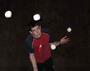 Peter Bone juggling 9 balls, photo by Luke Burrage; cropped