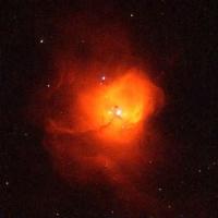 This glowing cloud of orange material is a  birthplace of stars.