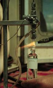 Flame sealing a borosilicate ampoule for CFC analysis.