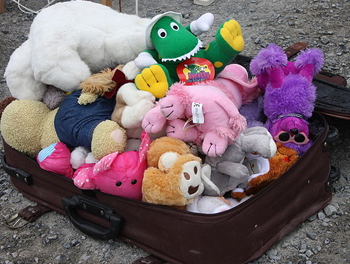 stuffed animals in a suitcase