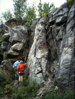 People examine fractured rock