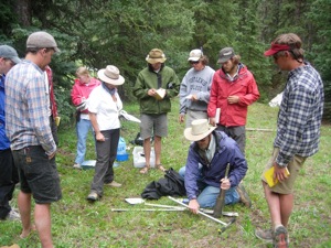 A photo of FLC undergraduate student collecting soil samples.