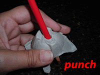 punch a hole through the egg cup