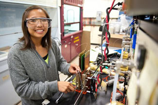 Student working on a hydrogen fuel cell 