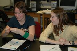 students doing surface tension demonstration