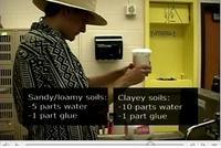 Student makes water/glue mixture for soil monolith