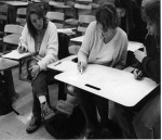 thumbnail of black and white image of students at table