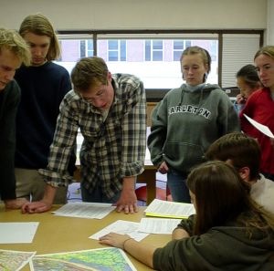 Jason Lord a GEO 110 student examines maps