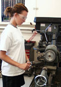 Student using shop tools to prepare an experiment