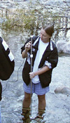 Student measuring stream discharge