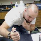 Picture of student pipeting in lab