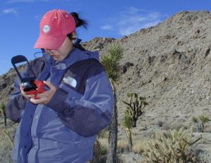 A student uses a GPS connected to a PDA to determine their location