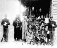 Eight Crow prisoners under guard at Crow agency, Montana.
