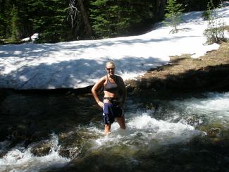 Fording the creek in high run-off season, early July.