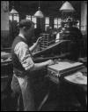 Photo of worker operating shoe manufacturing equipment